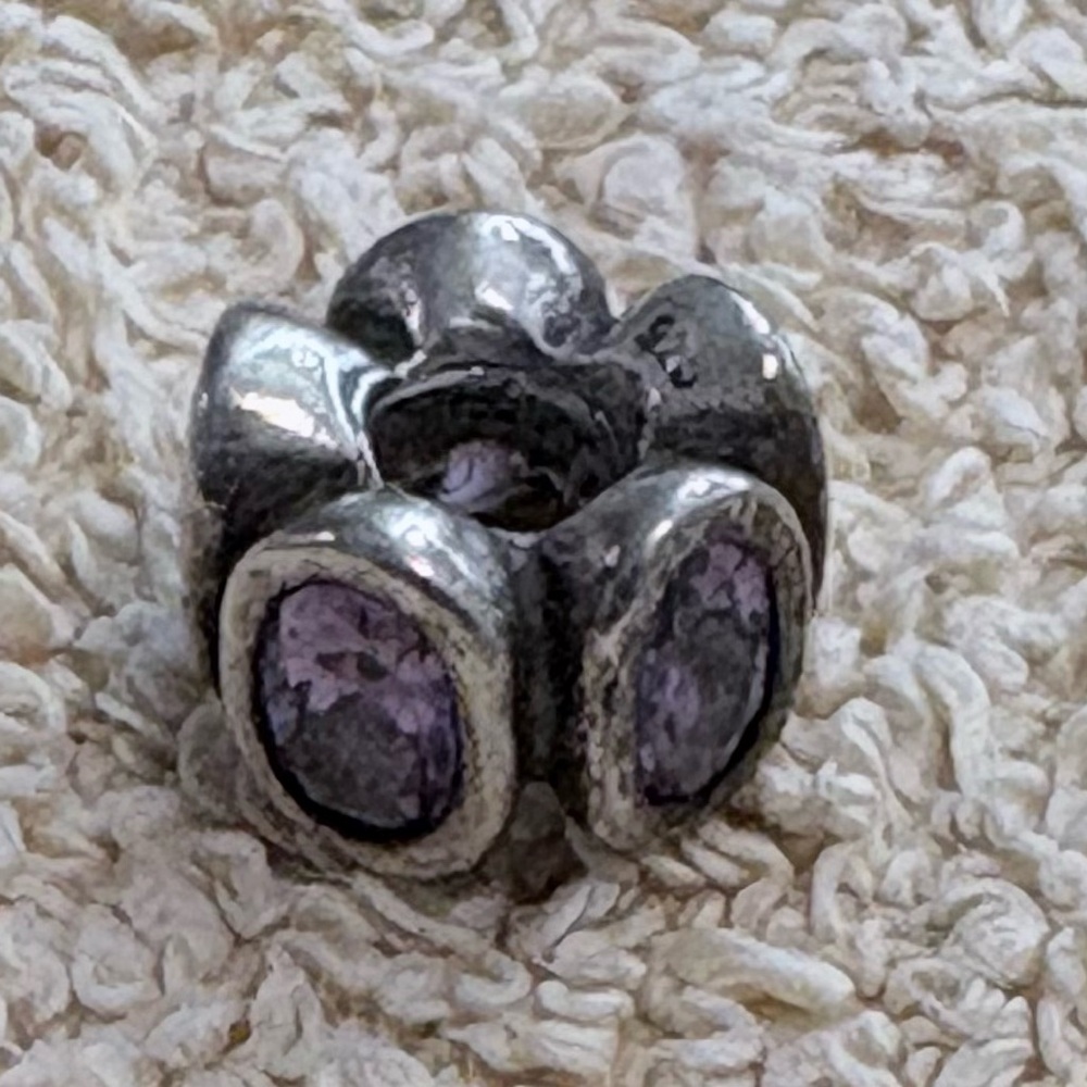 Retired Pandora sterling silver charm with Amethyst colored cubic zirconia stone